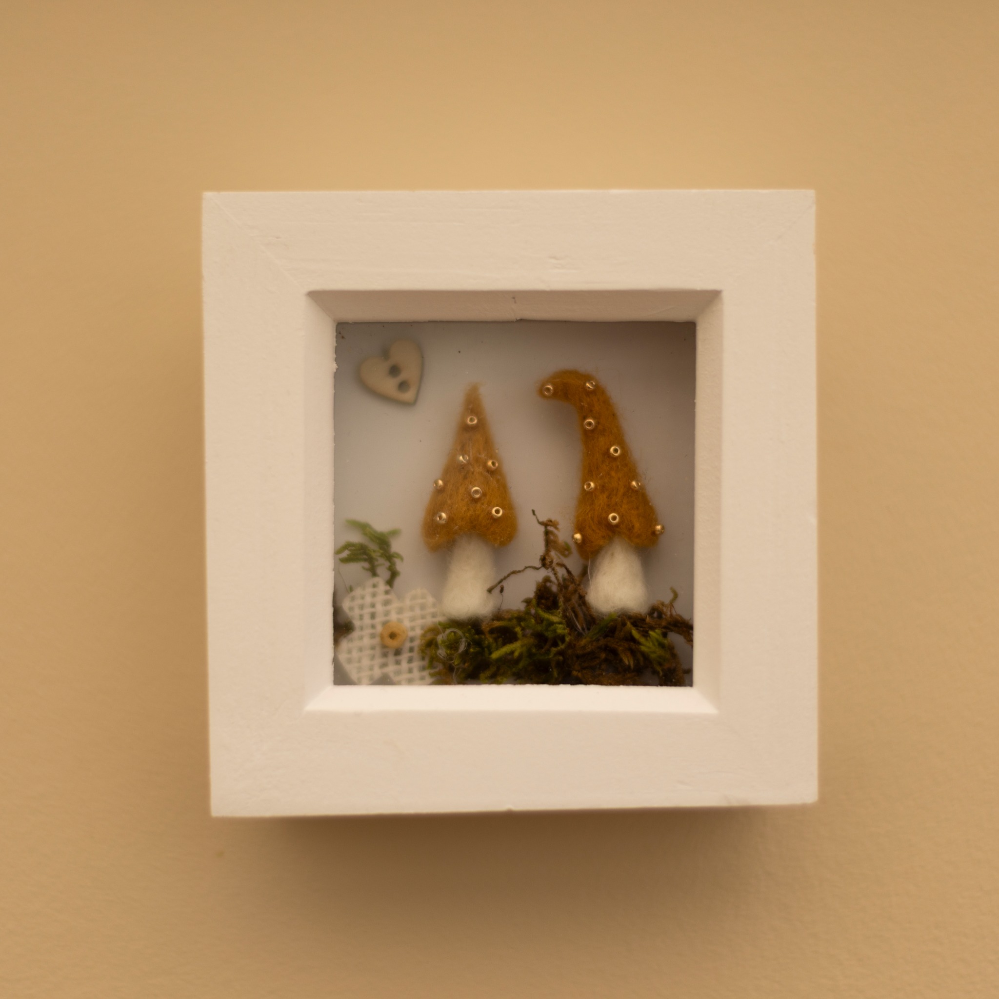 Shadow box style miniature felt mushroom scene.